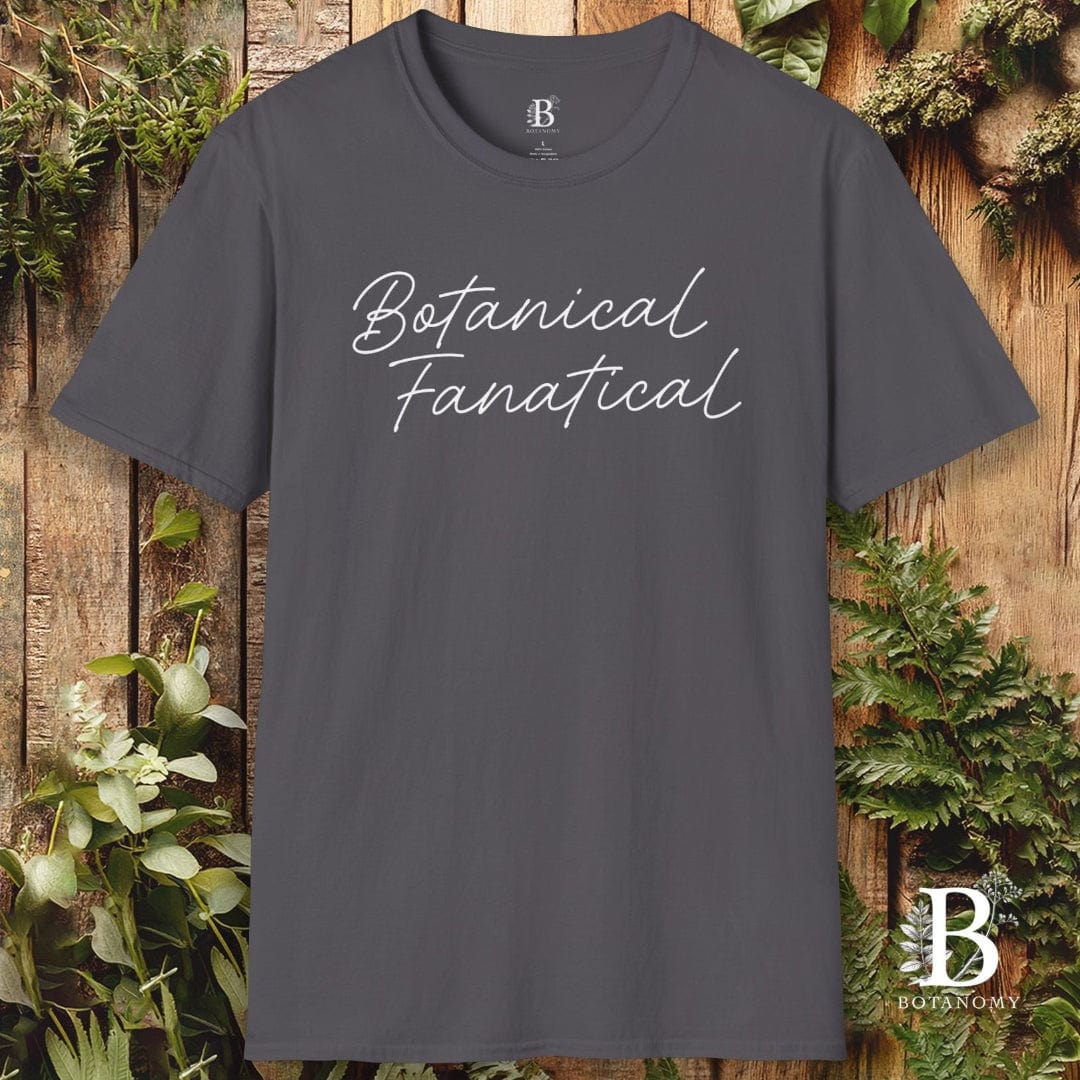 Gray t-shirt with 'Botanical Fanatical' text on a wooden background with plants
