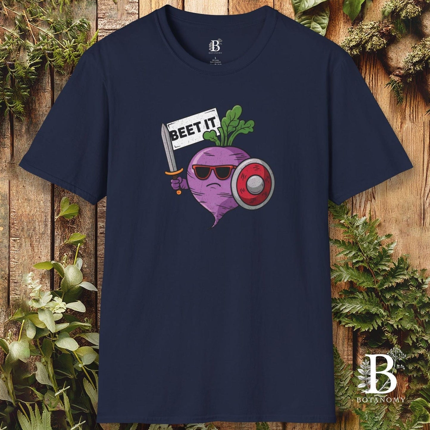 Navy blue t-shirt with a graphic of a beet wearing sunglasses and holding a sign that says 'BEET IT' on a wooden background.
