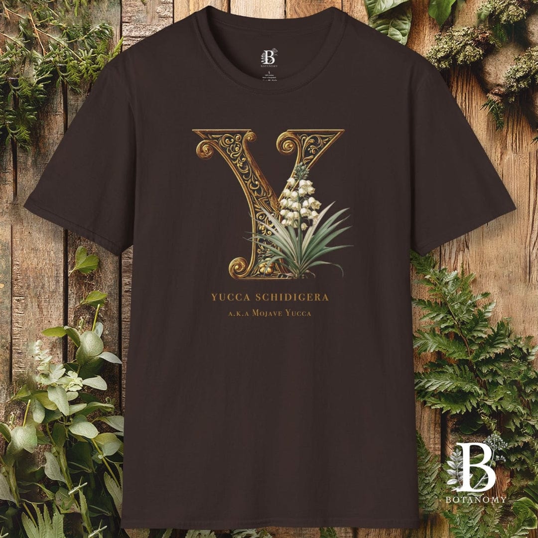 Black t-shirt with decorative letter 'Y' design on a wooden background