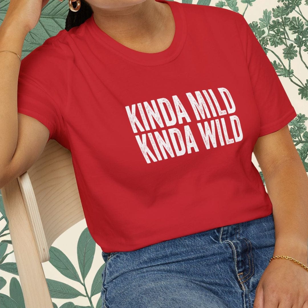 Person wearing a red t-shirt with 'KINDA MILD KINDA WILD' text, sitting on a chair.