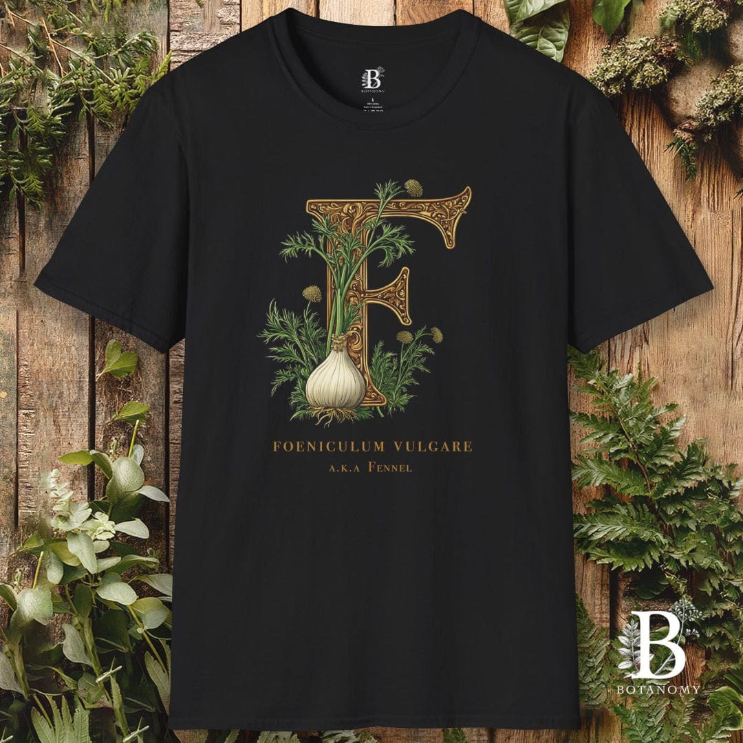 Black t-shirt with botanical design and brand logo on a wooden background