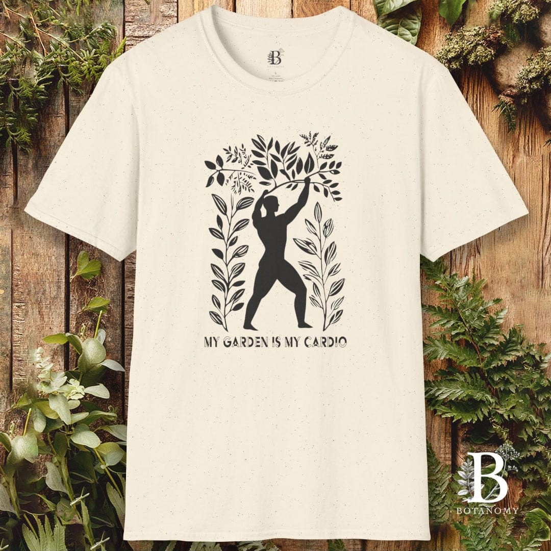 Beige t-shirt with black graphic design and text on a wooden background with plants