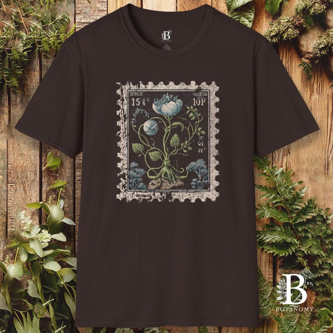 Black t-shirt with a floral stamp design on a wooden background