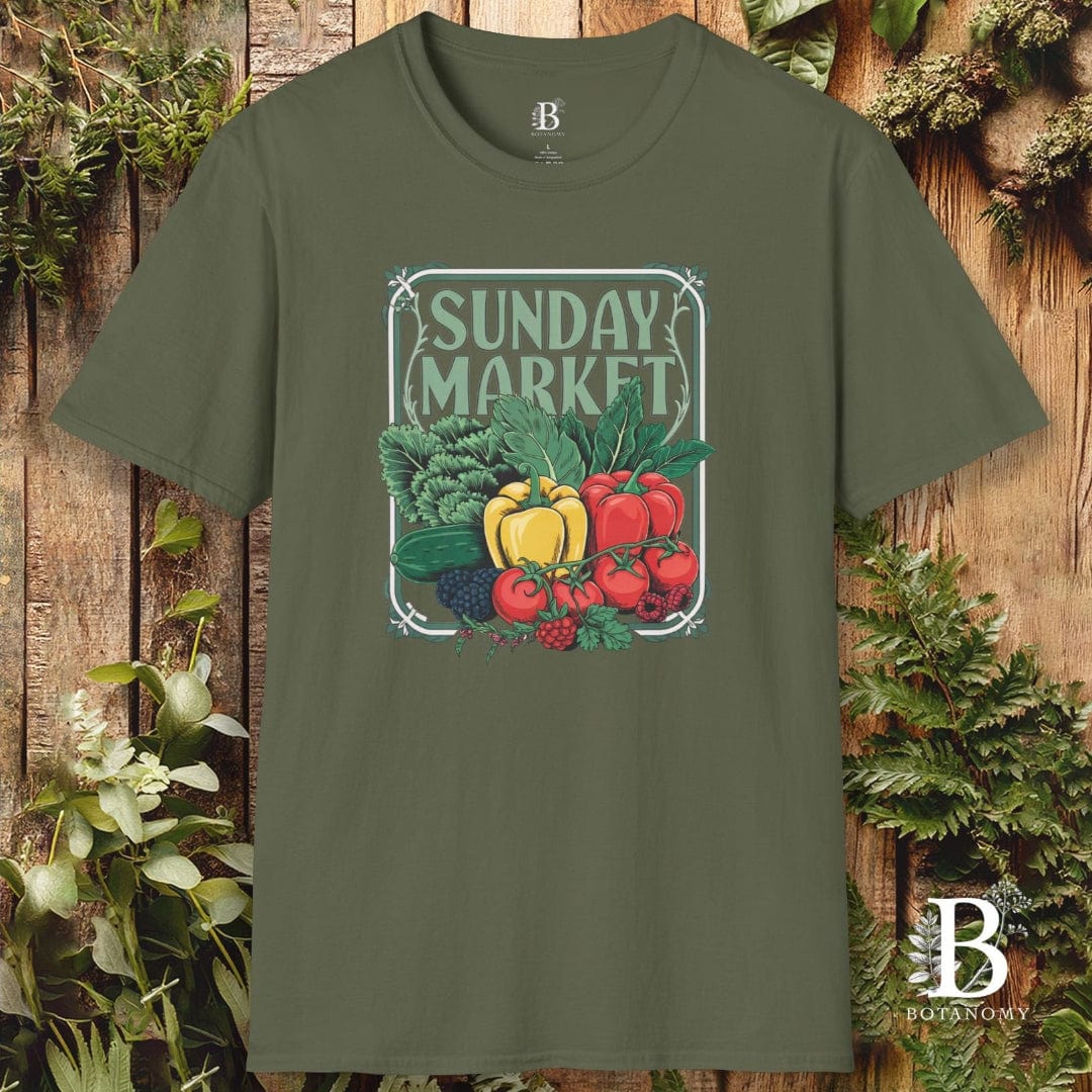 Green t-shirt with 'Sunday Market' graphic on a wooden background