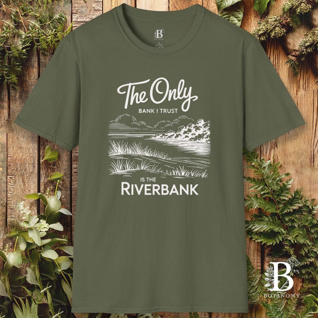 Green t-shirt with nature-themed design and text on a wooden background