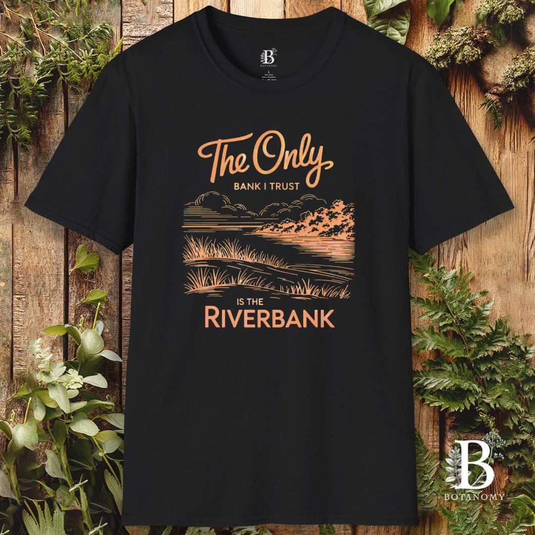 Black t-shirt with scenic design and text on a wooden background