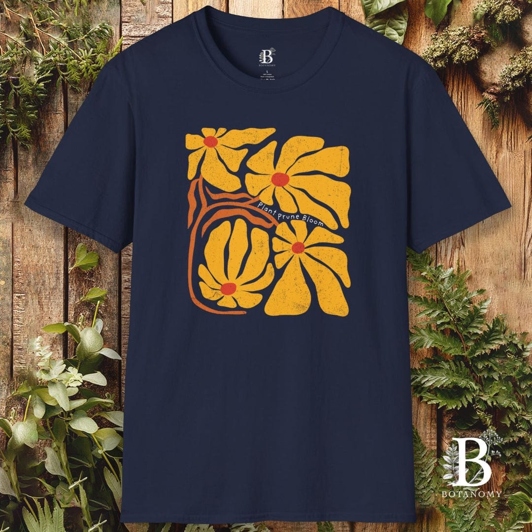 Navy blue t-shirt with yellow floral design on a wooden background