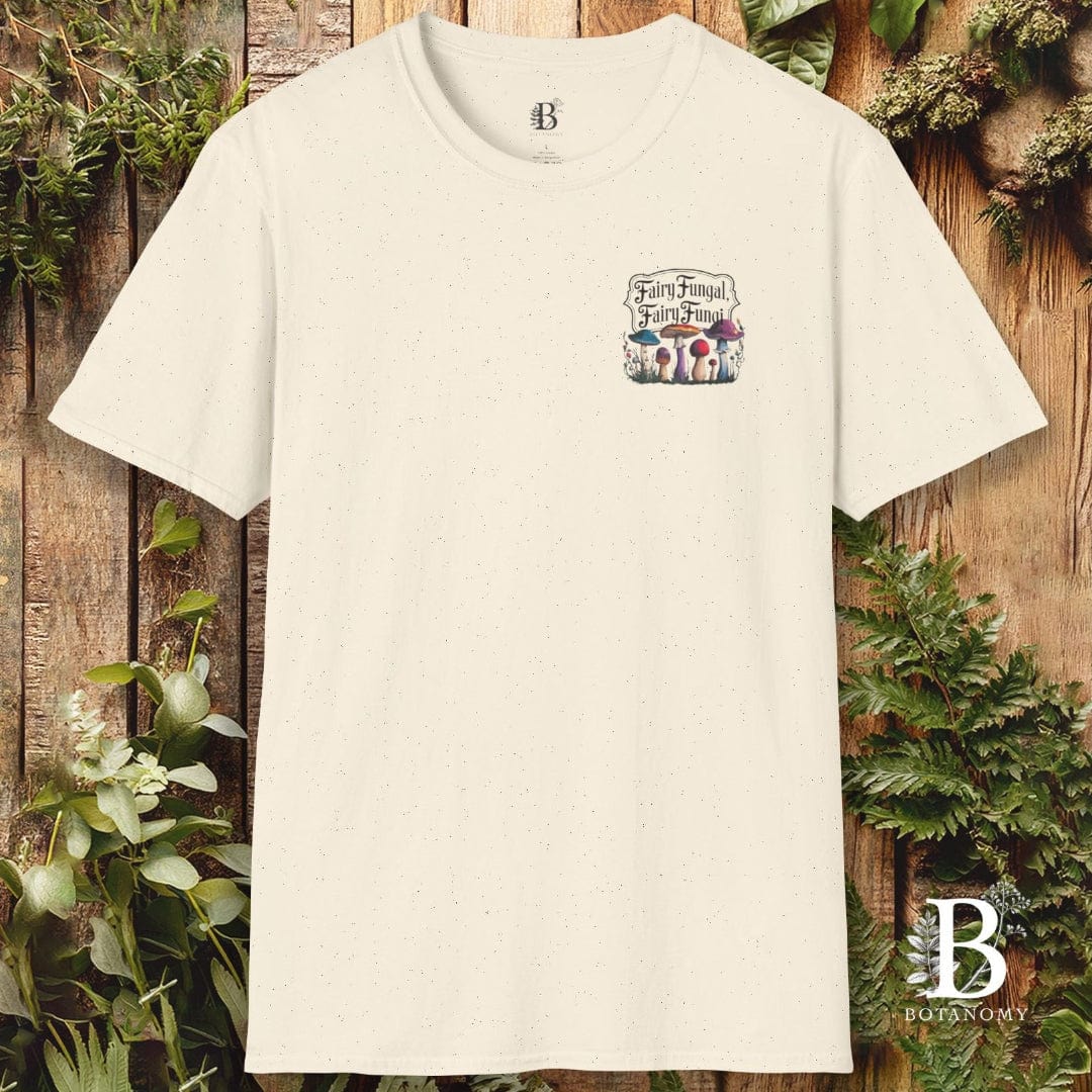 Beige t-shirt with a graphic design on a wooden background with plants