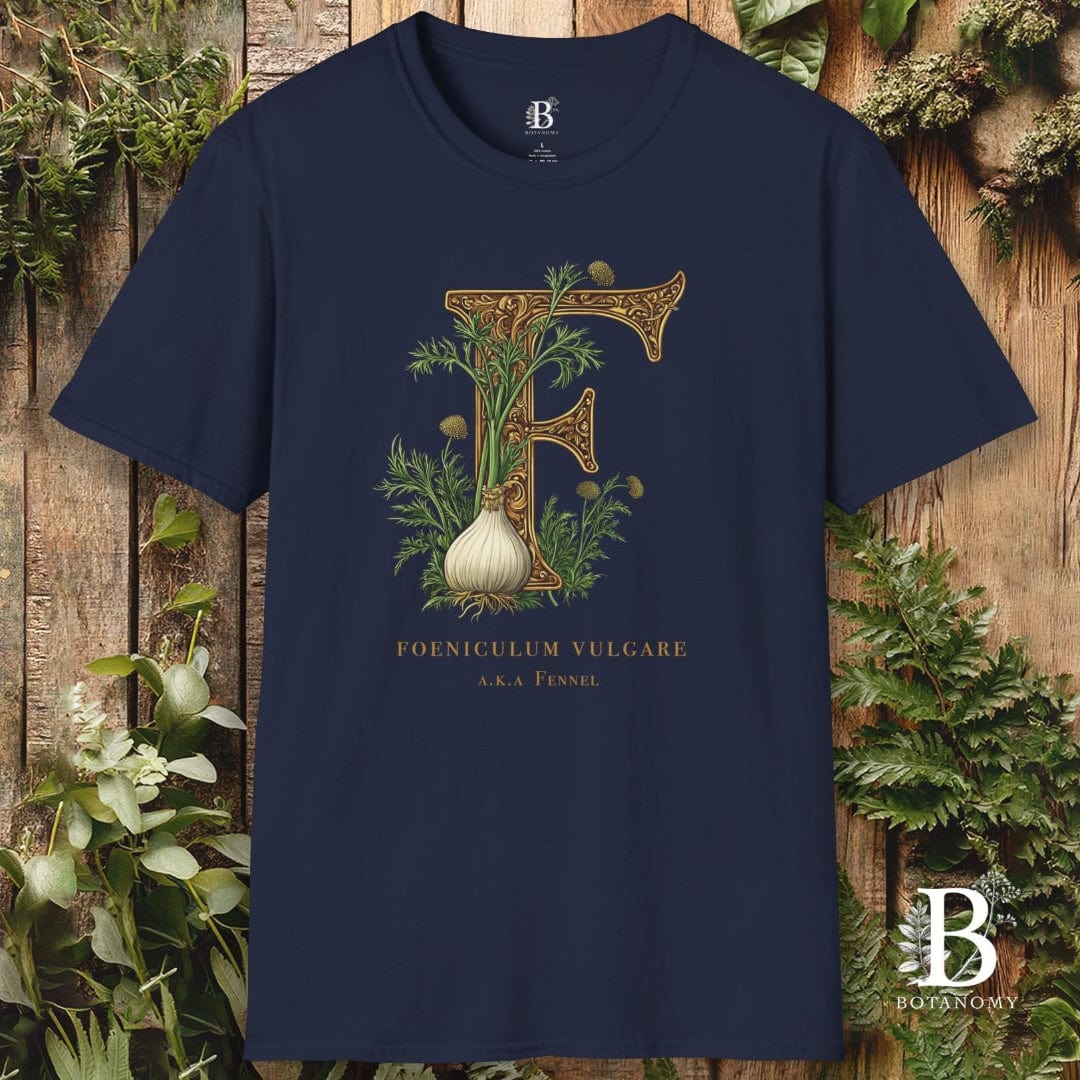 Navy blue t-shirt with decorative letter 'F' design on a wooden background
