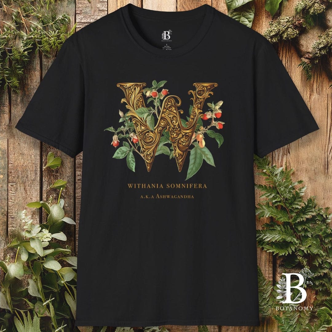 Black t-shirt with decorative letter 'W' design on a wooden background