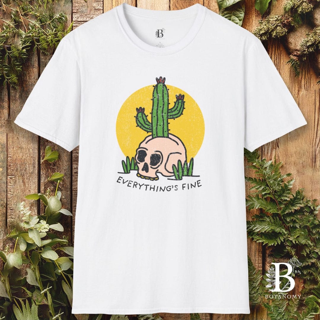 White t-shirt with a cactus and skull design on a wooden background