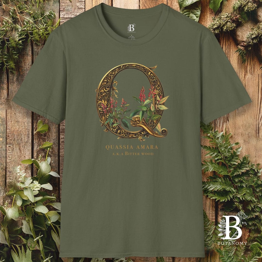 Green t-shirt with decorative 'Q' design on a wooden background
