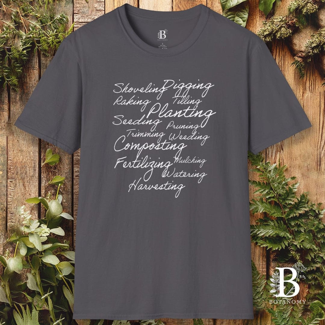 Gray t-shirt with gardening-themed text on a wooden background with plants