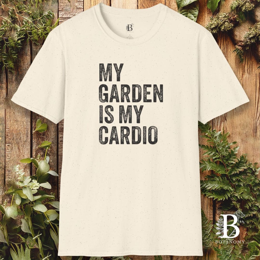 Beige t-shirt with 'My garden is my cardio' text on a wooden background with plants