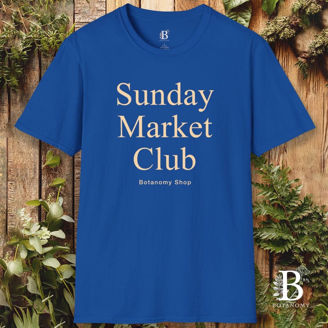 Blue t-shirt with 'Sunday Market Club' text on a wooden background