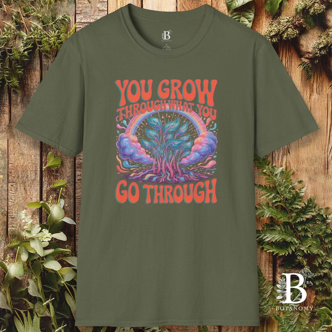 Green t-shirt with a graphic design and text on a wooden background