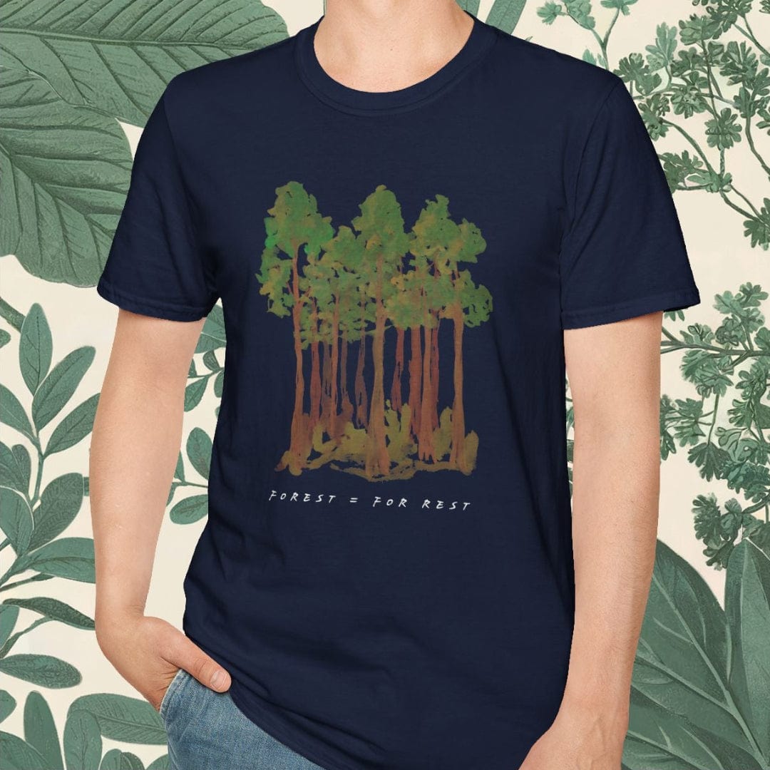 Person wearing a navy blue t-shirt with a forest design on a white background