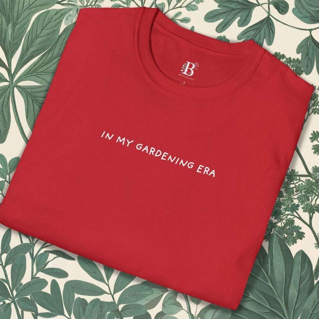 Red t-shirt with 'IN MY GARDENING ERA' text on a leaf-patterned background