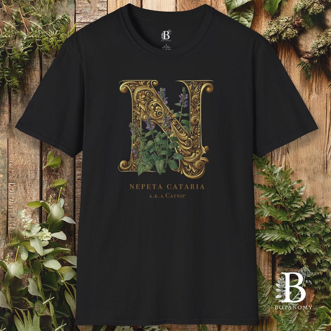 Black t-shirt with gold letter 'N' design on a wooden background