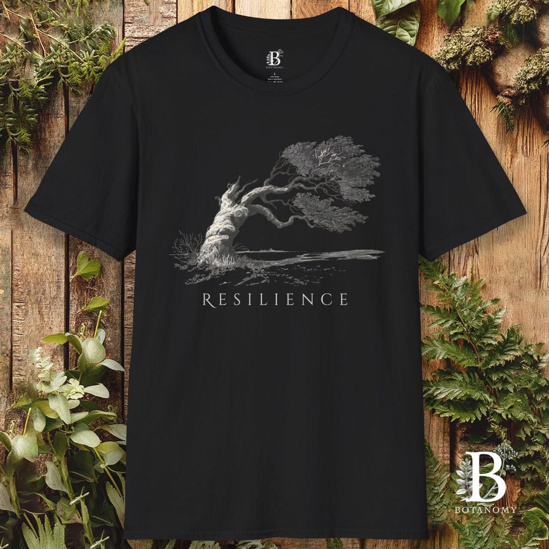 Black t-shirt with 'Resilience' graphic and brand logo on a wooden background