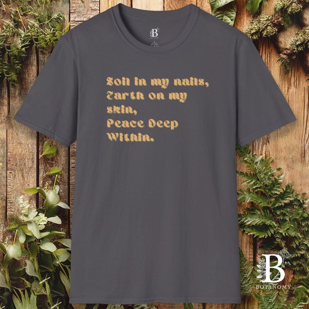 Gray t-shirt with text design on a wooden background with plants