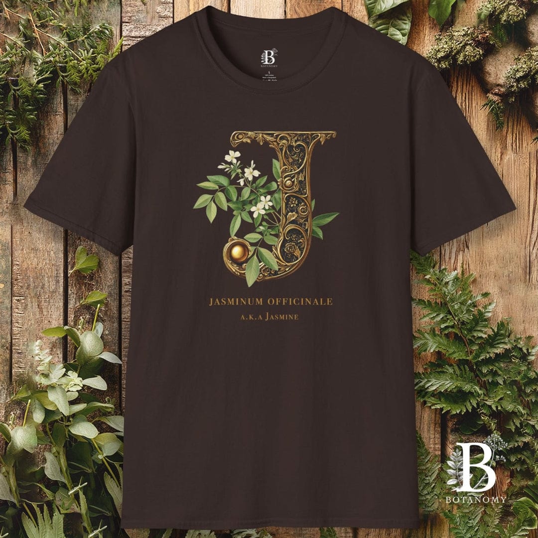 Black t-shirt with decorative letter 'J' design on a wooden background