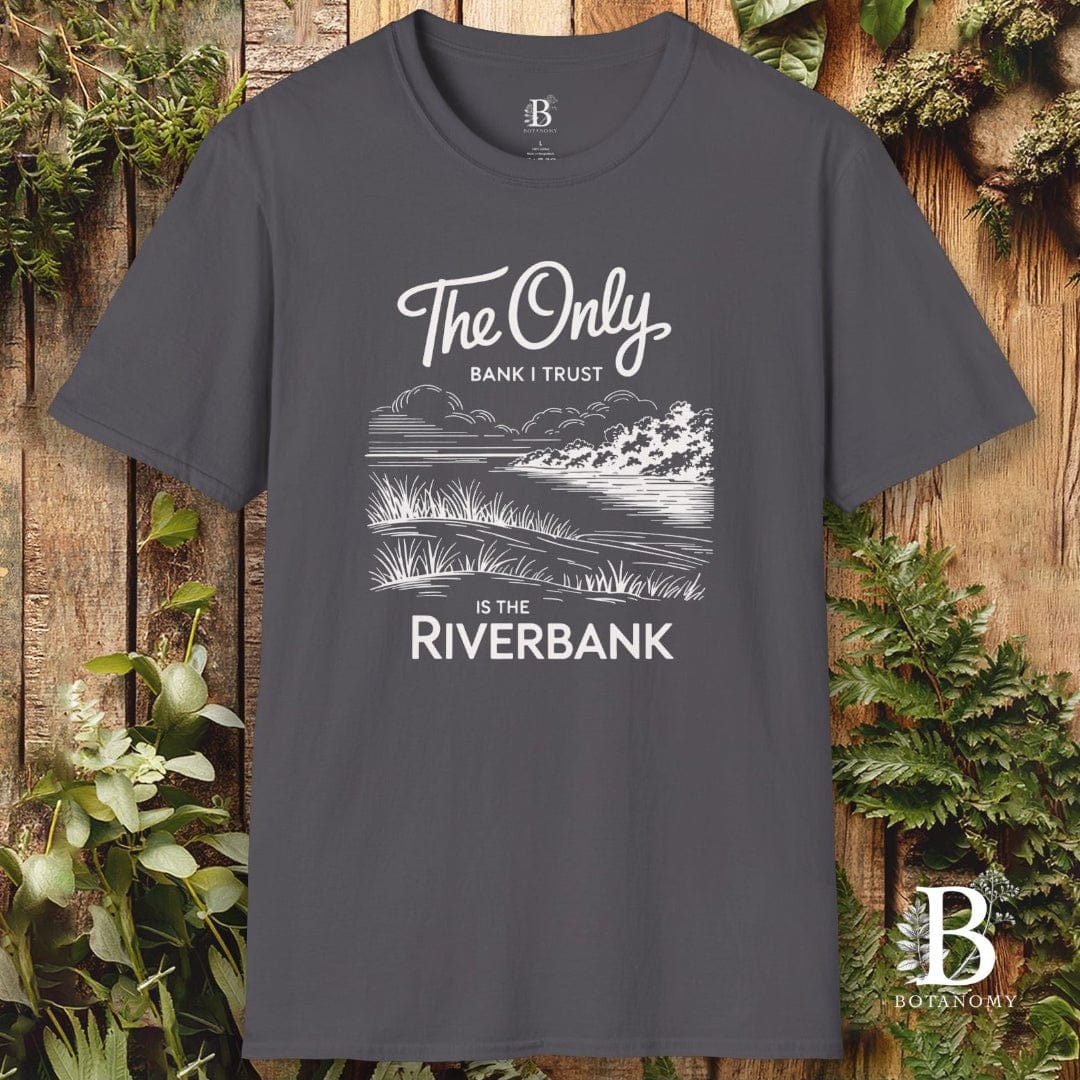 Gray t-shirt with nature-themed design and text on a wooden background