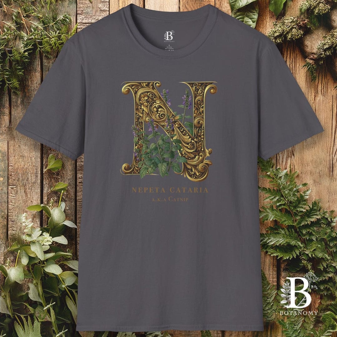 Gray t-shirt with decorative letter 'N' design on a wooden background