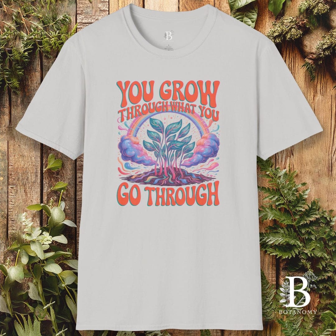 Gray t-shirt with motivational graphic and text on a wooden background