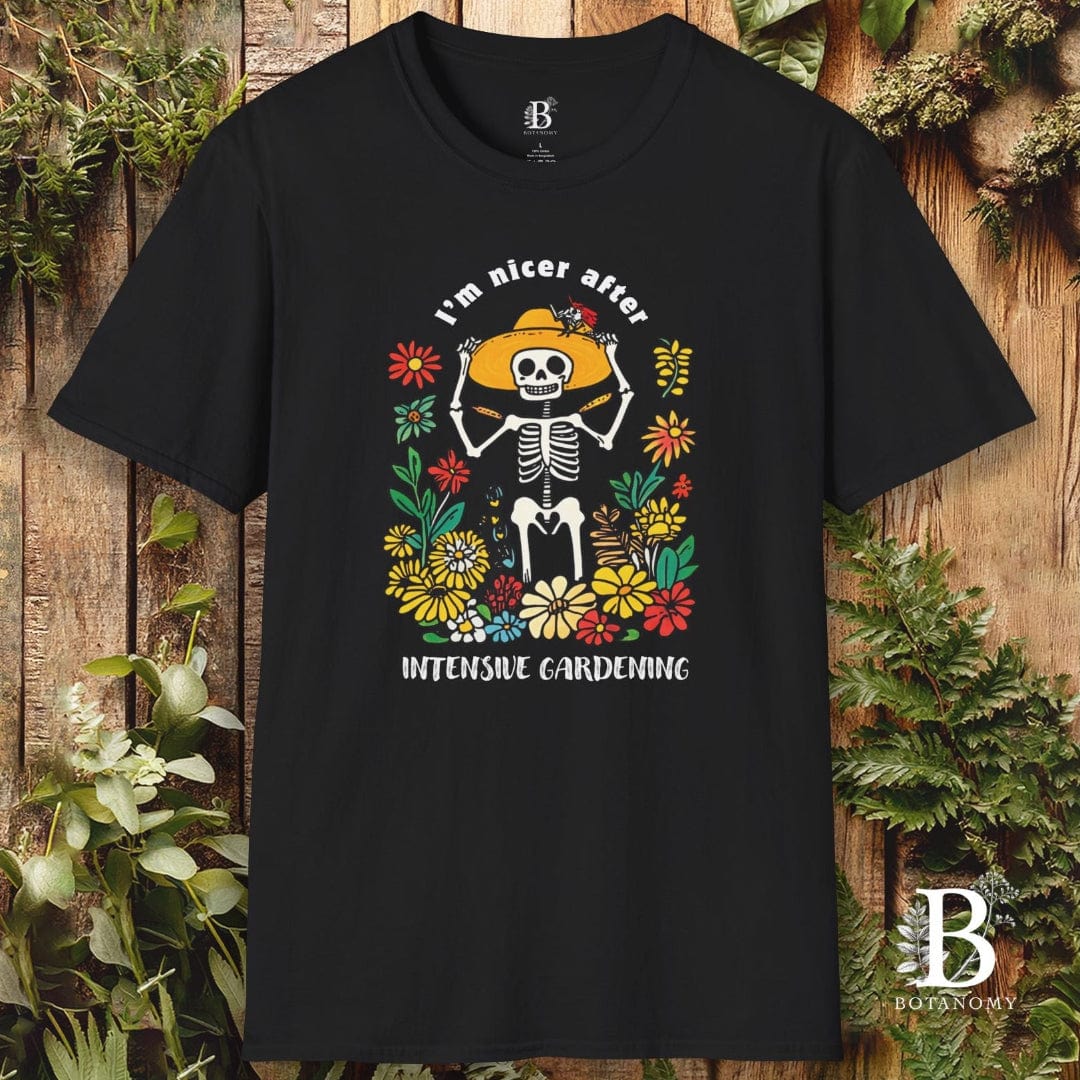 Black t-shirt with skeleton and floral design on a wooden background