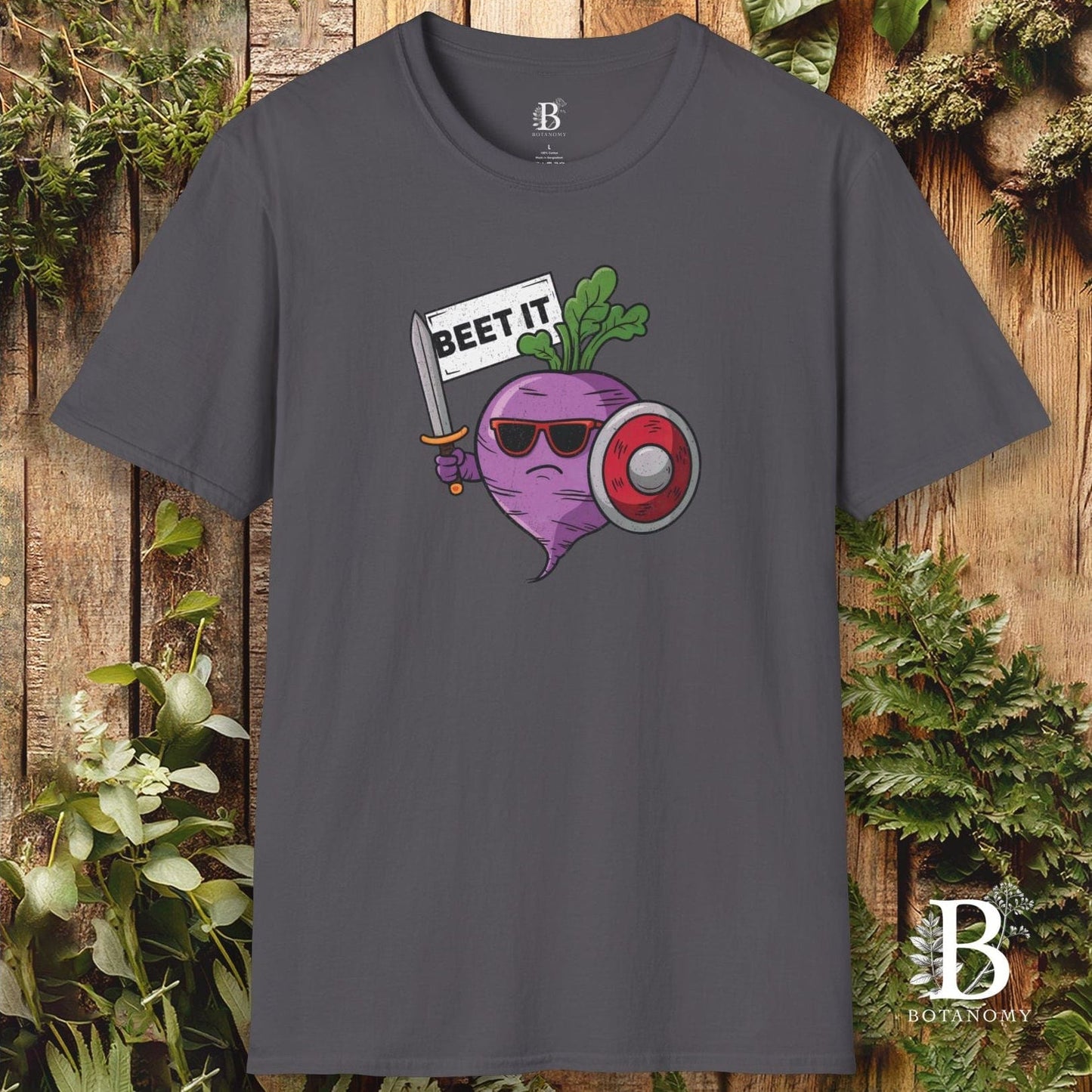 Gray t-shirt with a graphic of a beet wearing sunglasses and holding a sign that says 'BEET IT' against a wooden background.