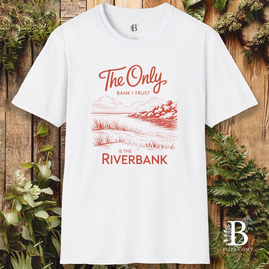 White t-shirt with red text and graphics on a wooden background