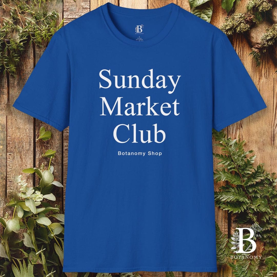 Blue t-shirt with 'Sunday Market Club' text on a wooden background