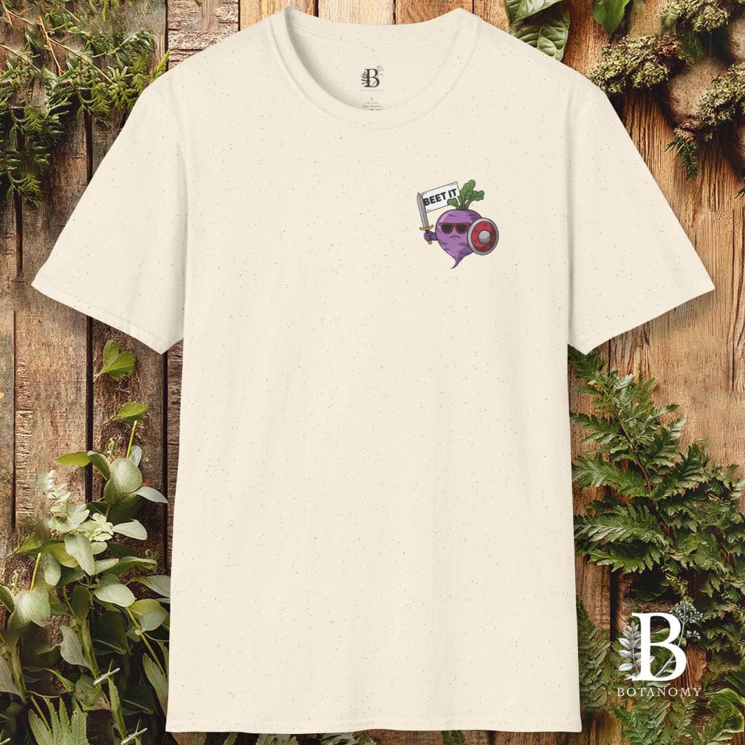 White t-shirt with a graphic design on a wooden background with plants