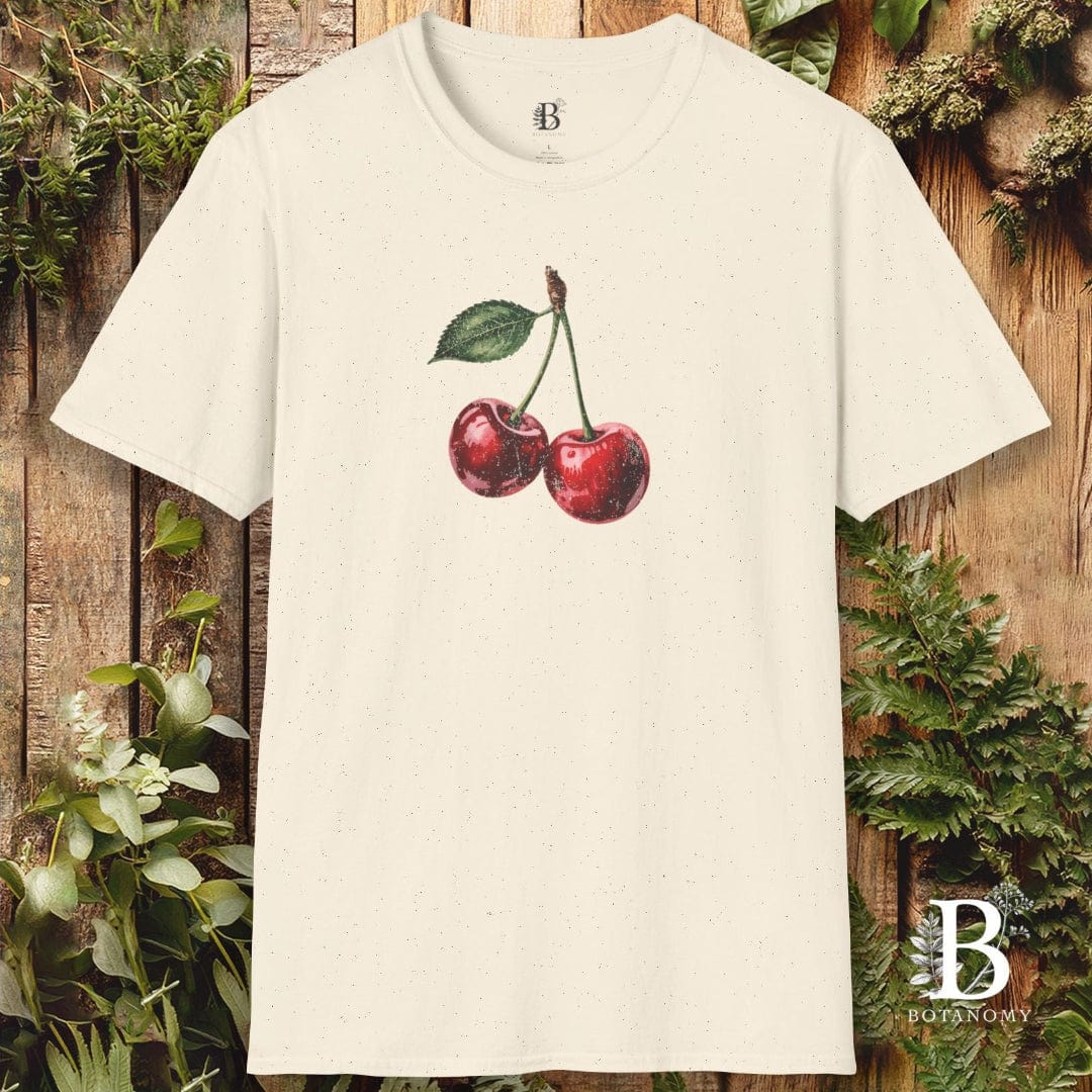 Beige t-shirt with cherry design on a wooden background