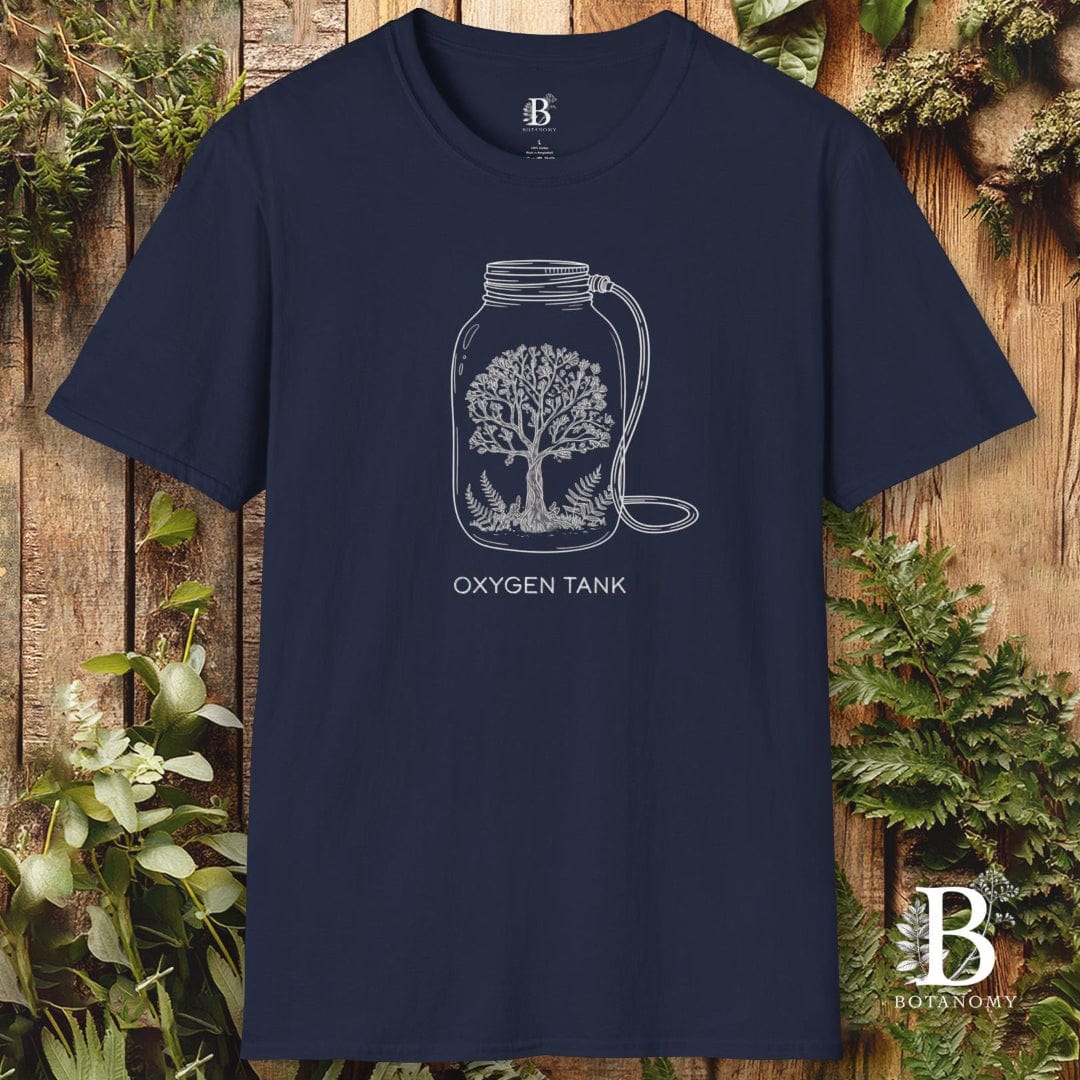 Navy blue t-shirt with white graphic design of an oxygen tank and tree on a wooden background with plants.
