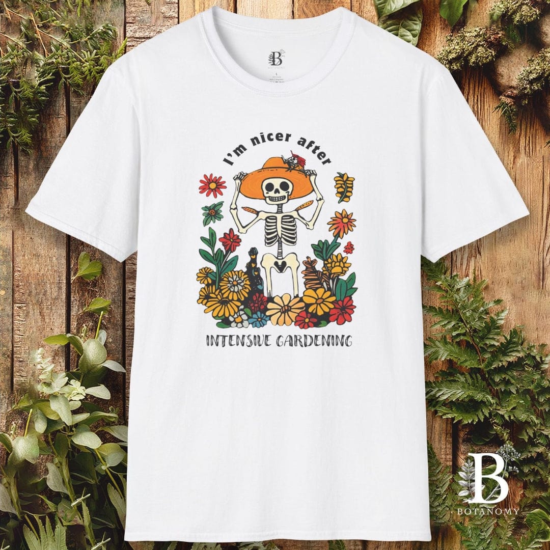 White t-shirt with a skeleton and floral design on a wooden background