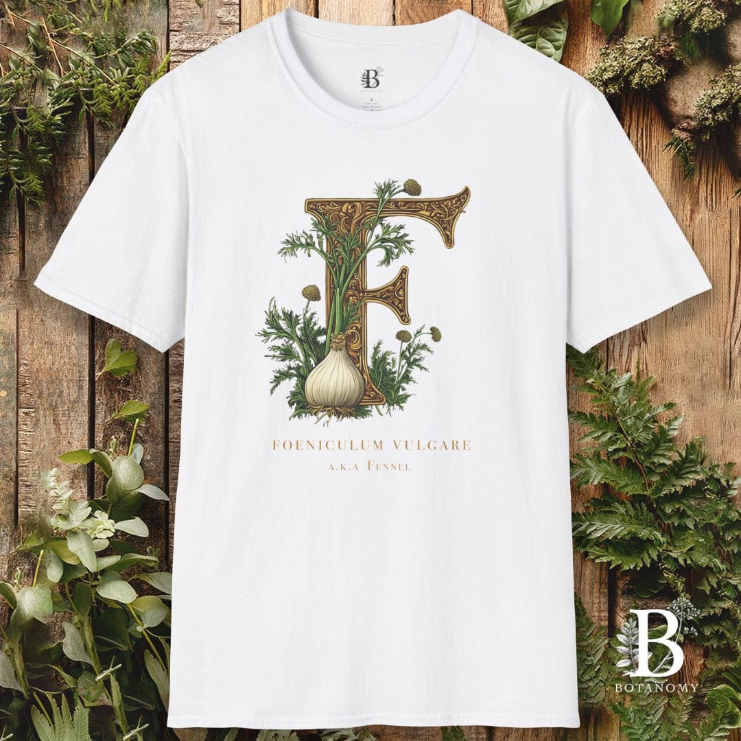 White t-shirt with botanical design and letter 'F' on a wooden background