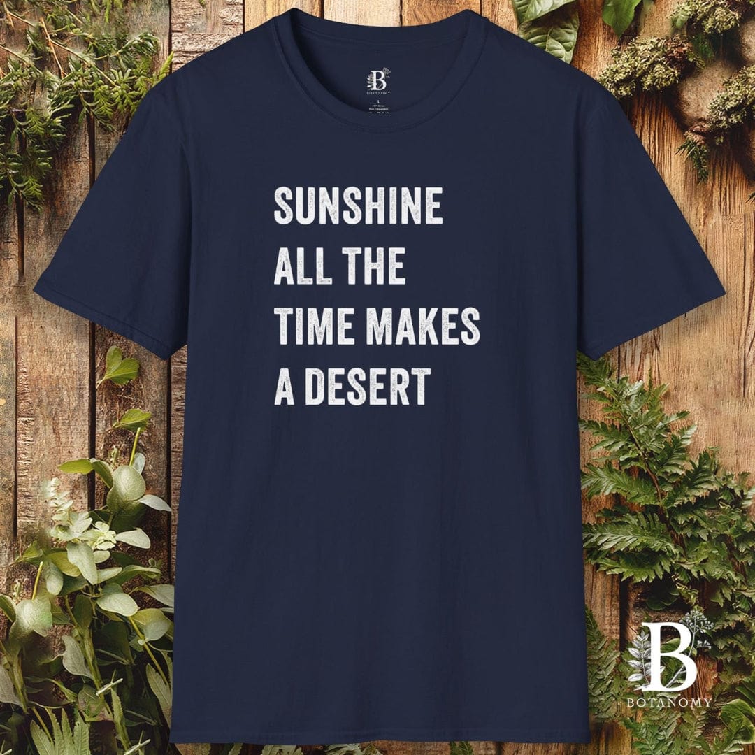 Navy blue t-shirt with white text on a wooden background