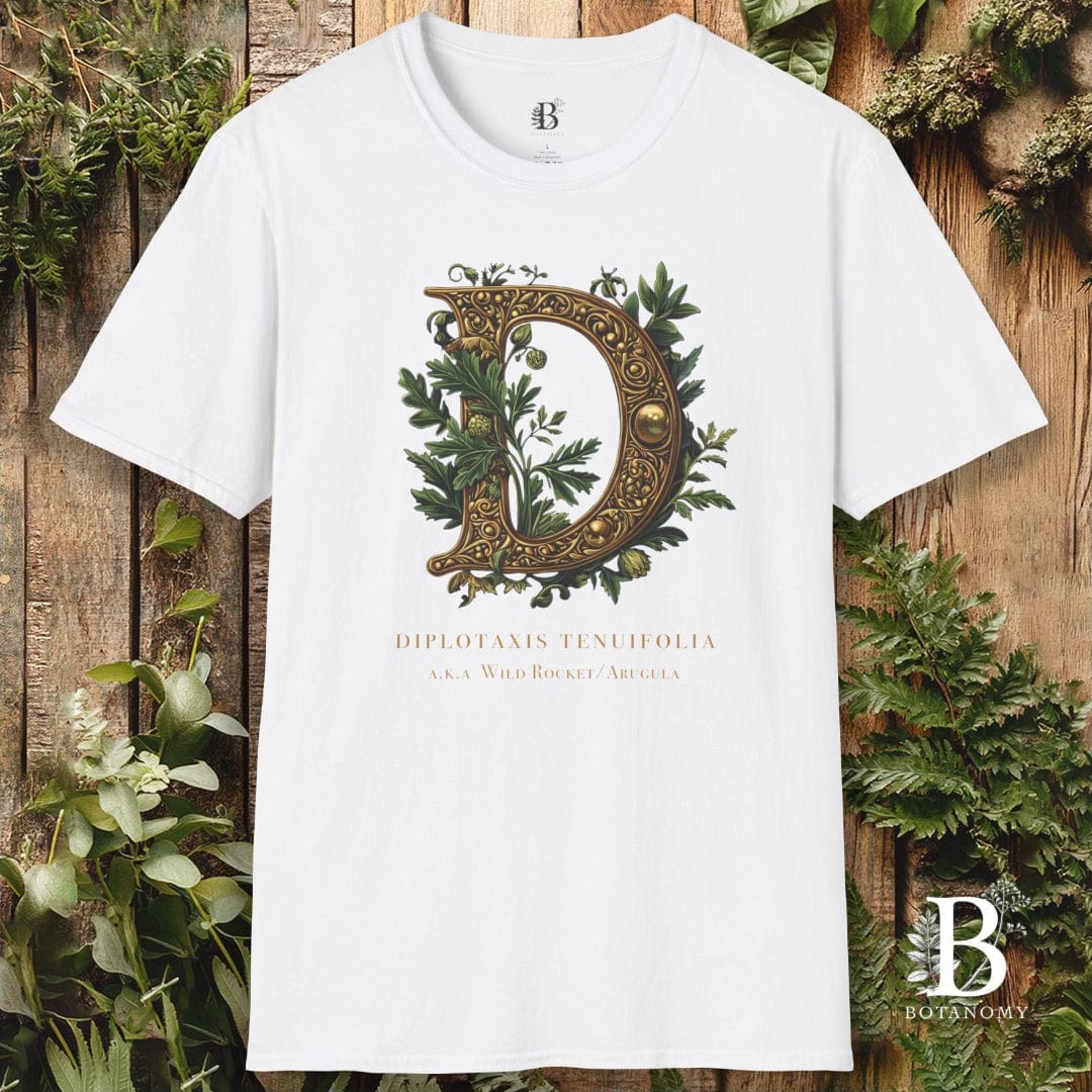 White t-shirt with decorative letter 'D' design on a wooden background