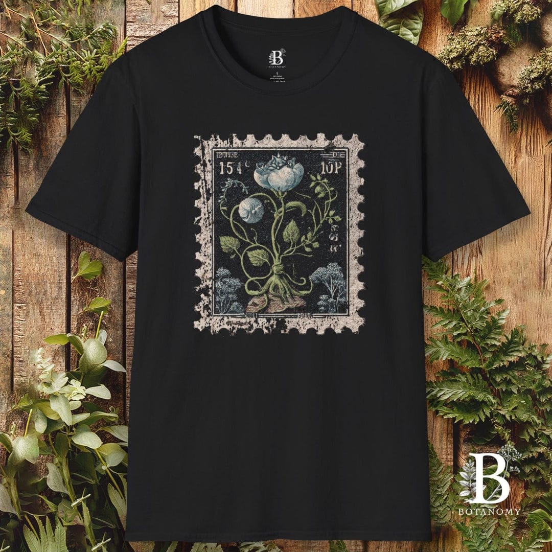 Black t-shirt with a floral stamp design on a wooden background