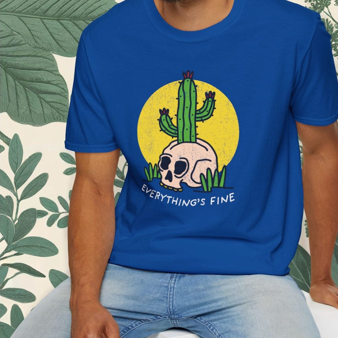Man wearing a blue t-shirt with a graphic design and text, sitting against a white background.