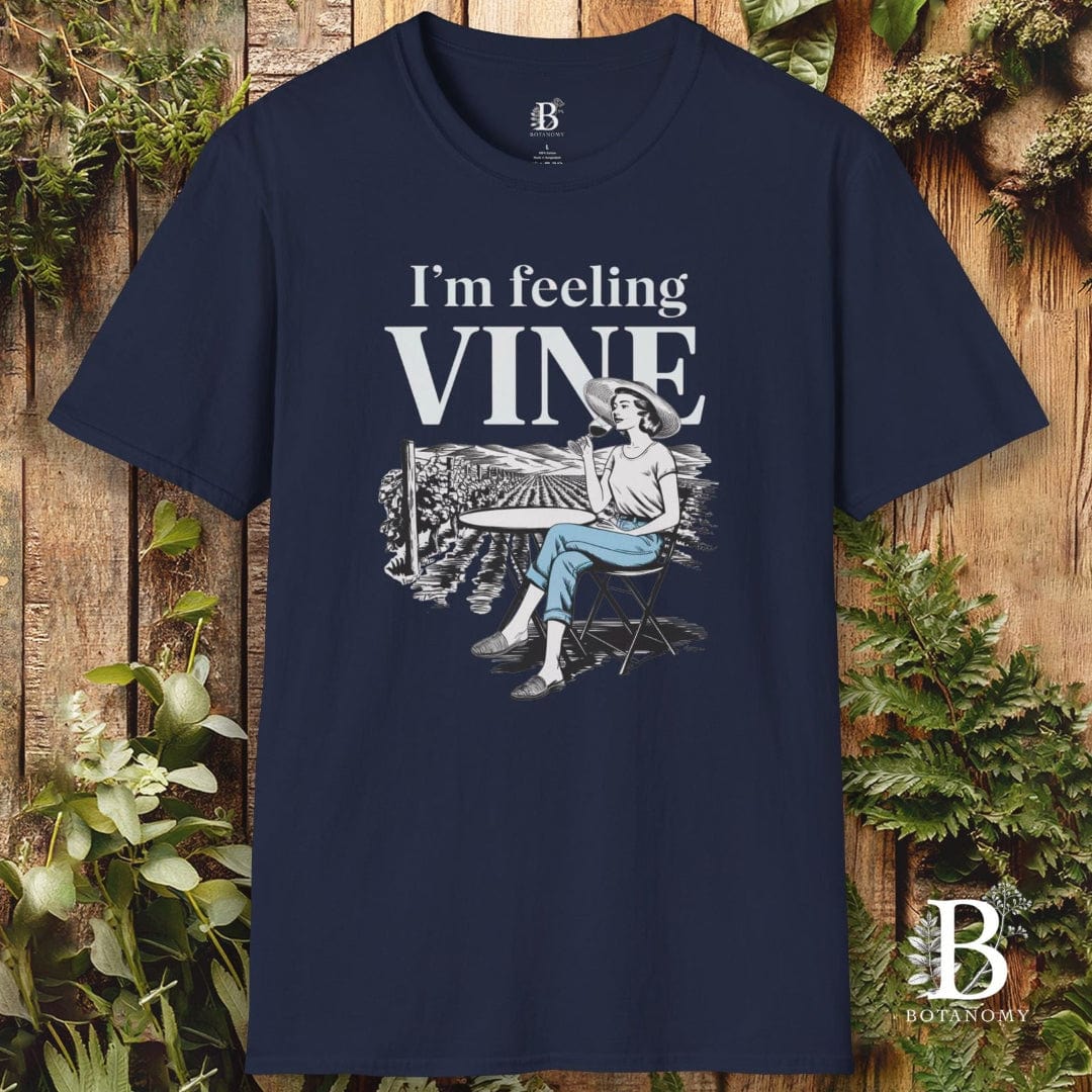 Navy blue t-shirt with 'I'm feeling vine' graphic design on a wooden background