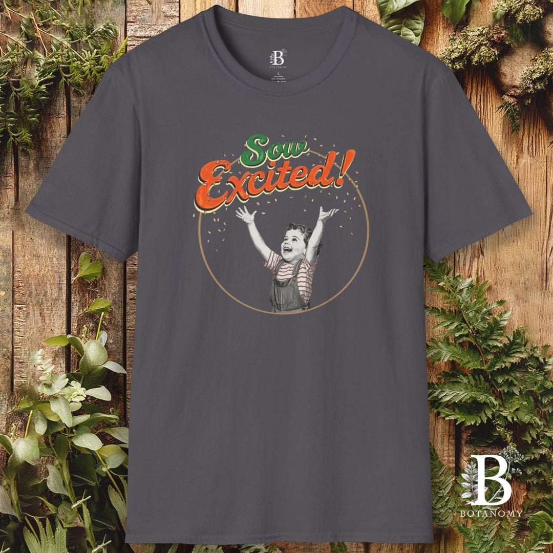 Gray t-shirt with a graphic design and text on a wooden background