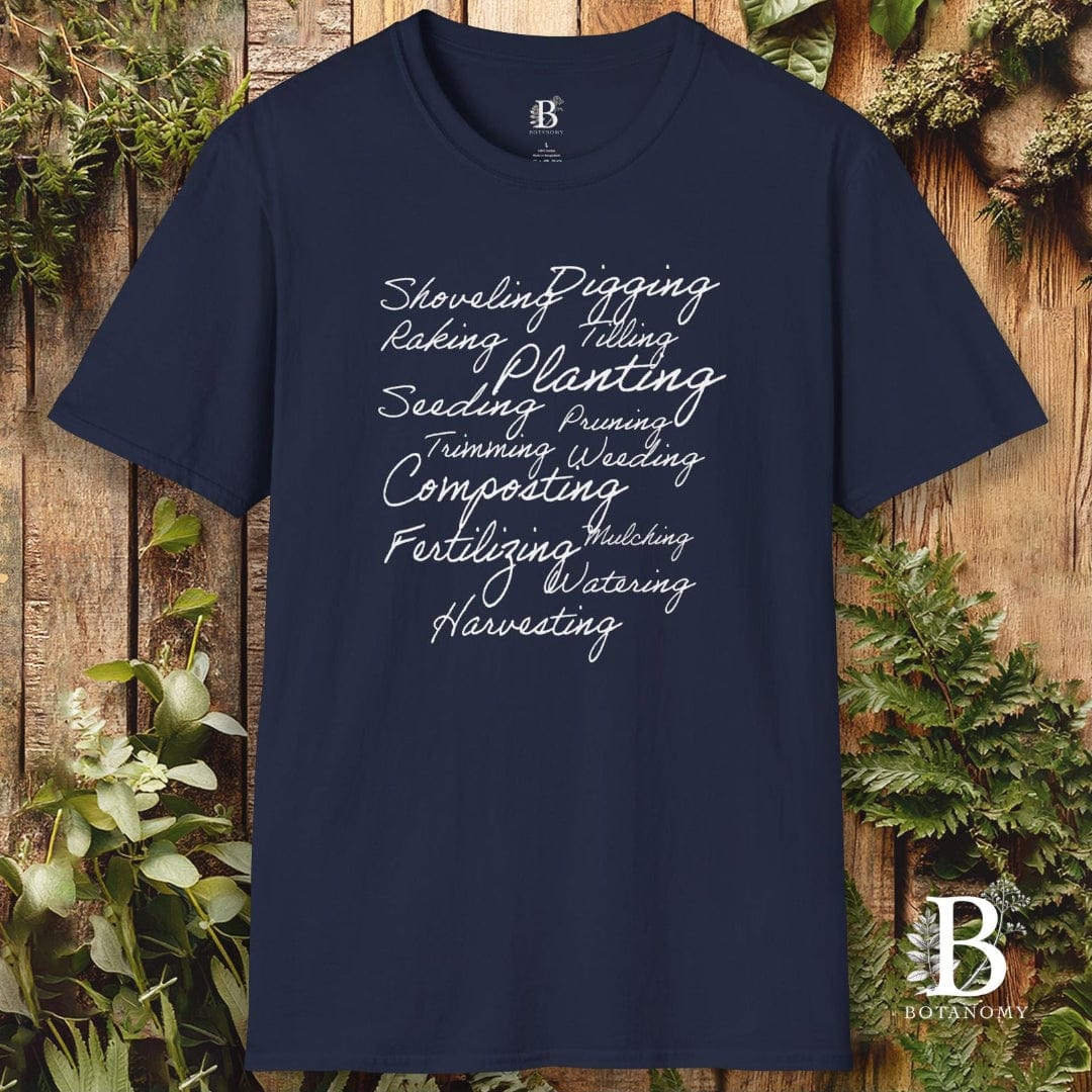 Navy blue t-shirt with gardening-related text on a wooden background with plants.