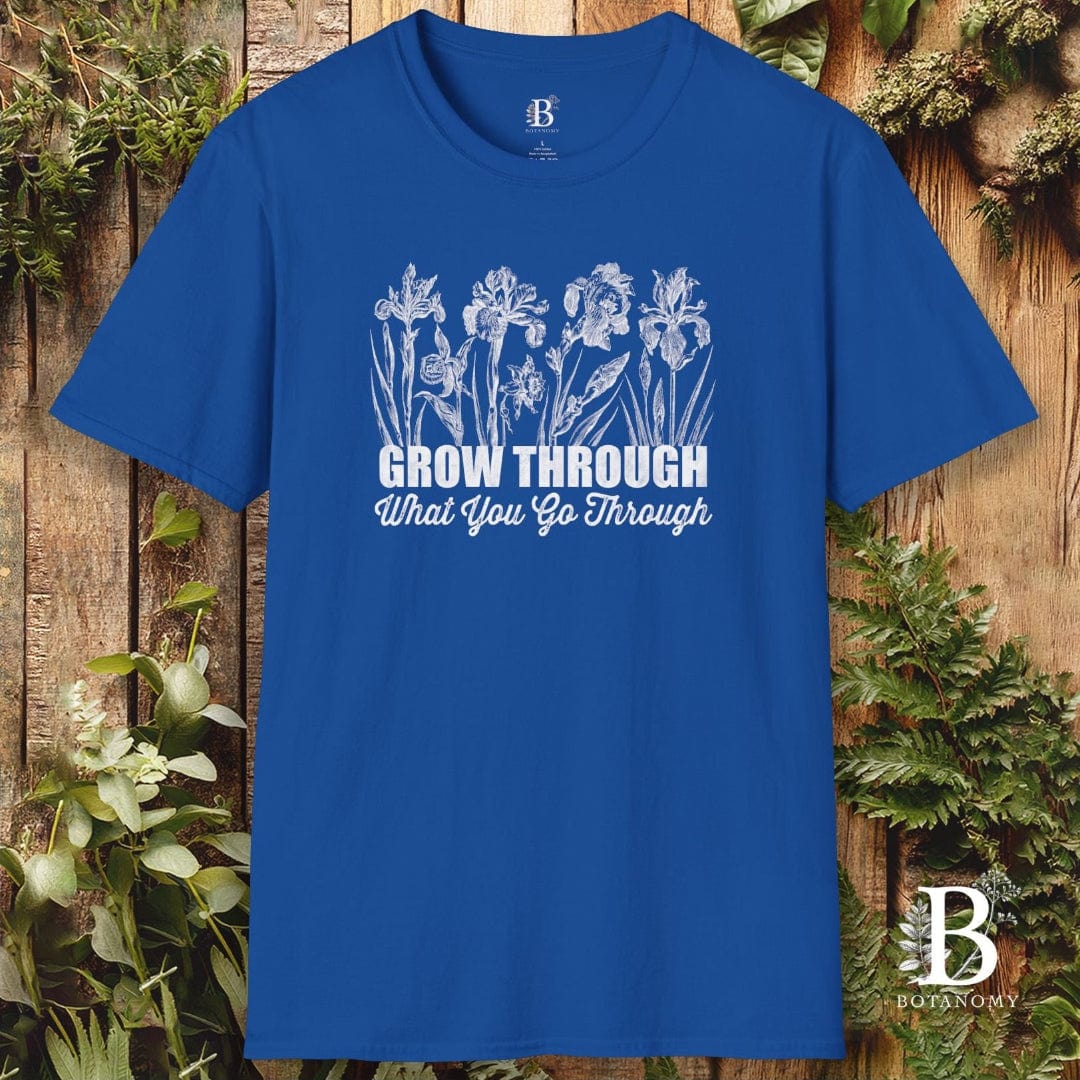 Blue t-shirt with floral design and text on a wooden background
