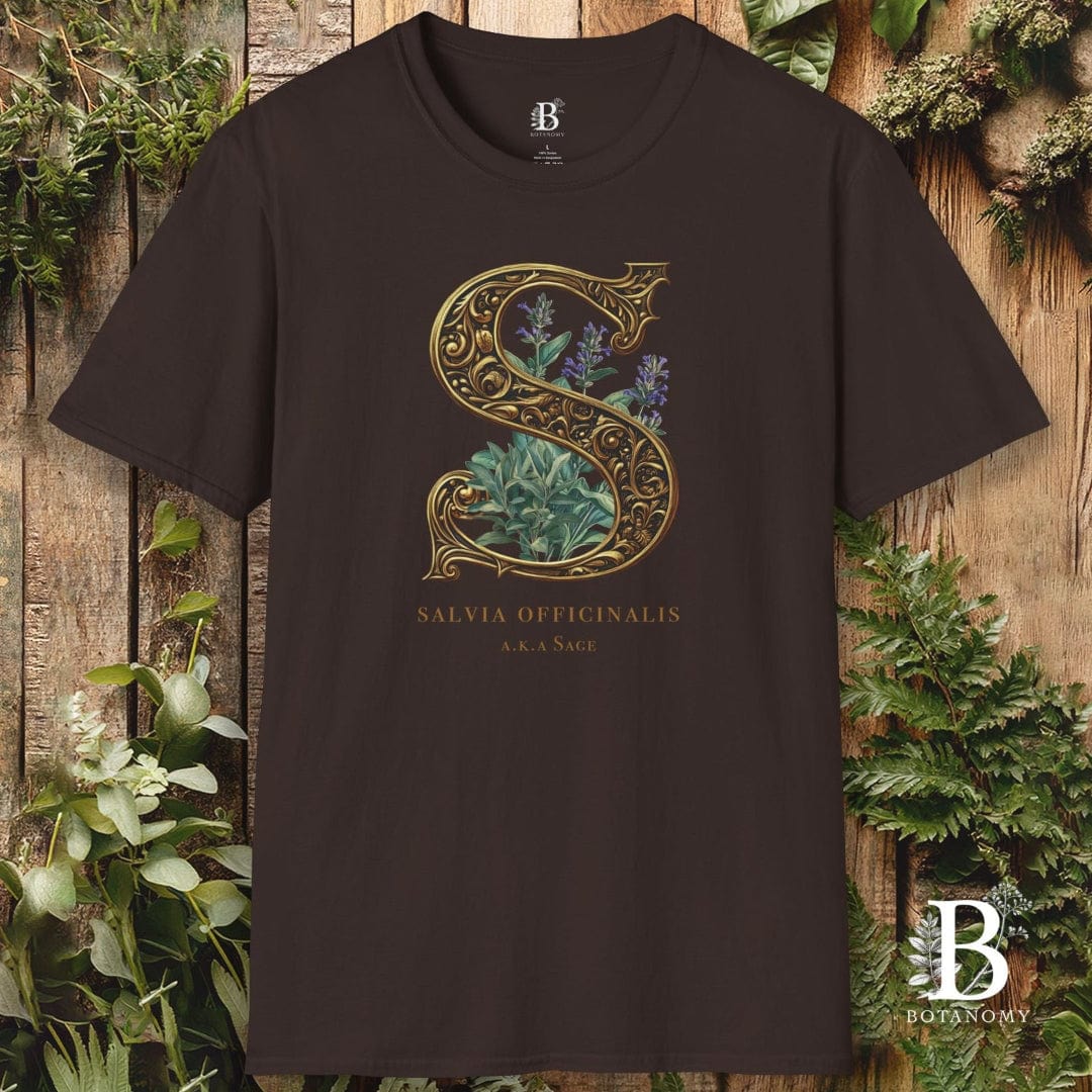 Brown t-shirt with decorative letter 'S' design on a wooden background