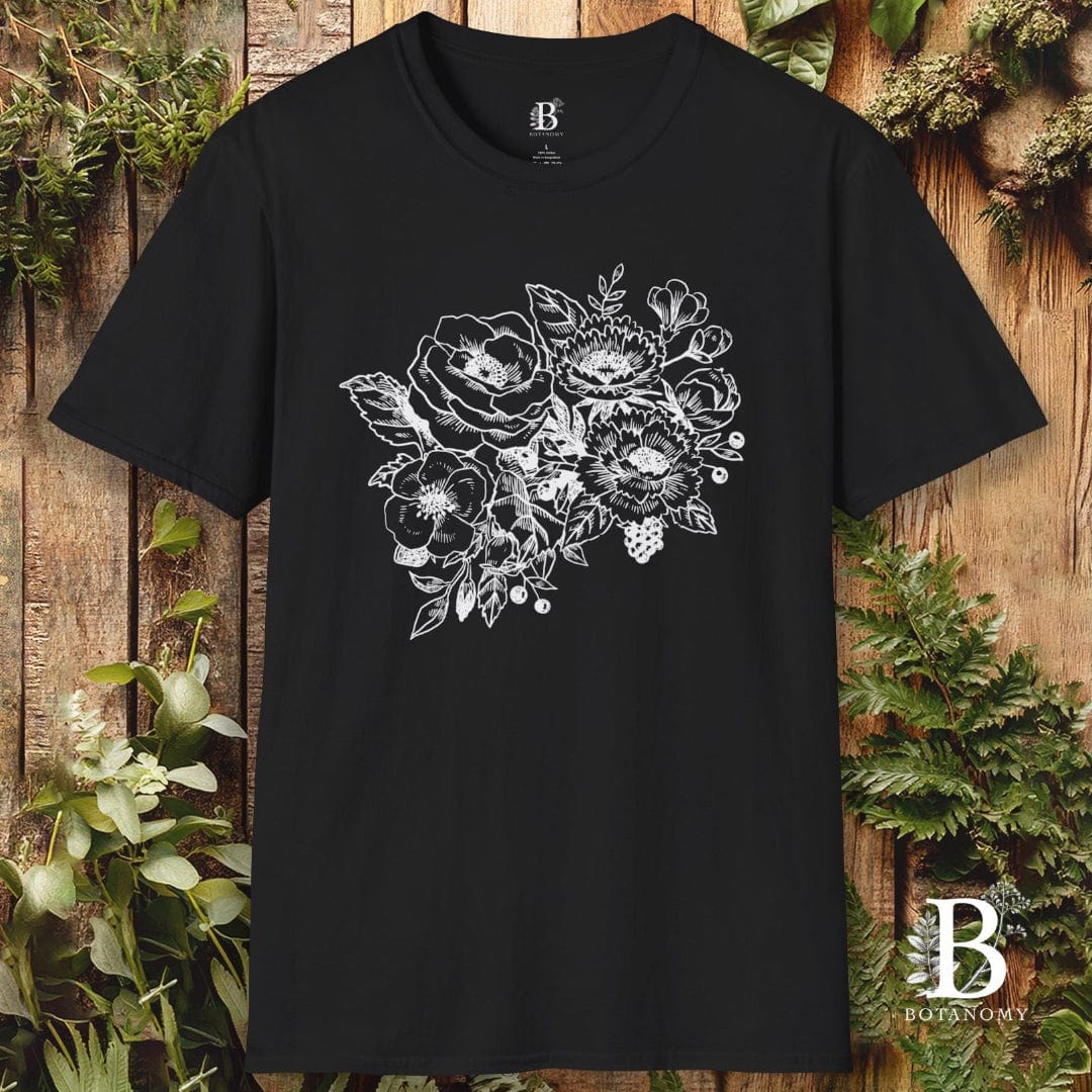Black t-shirt with floral design on a wooden background