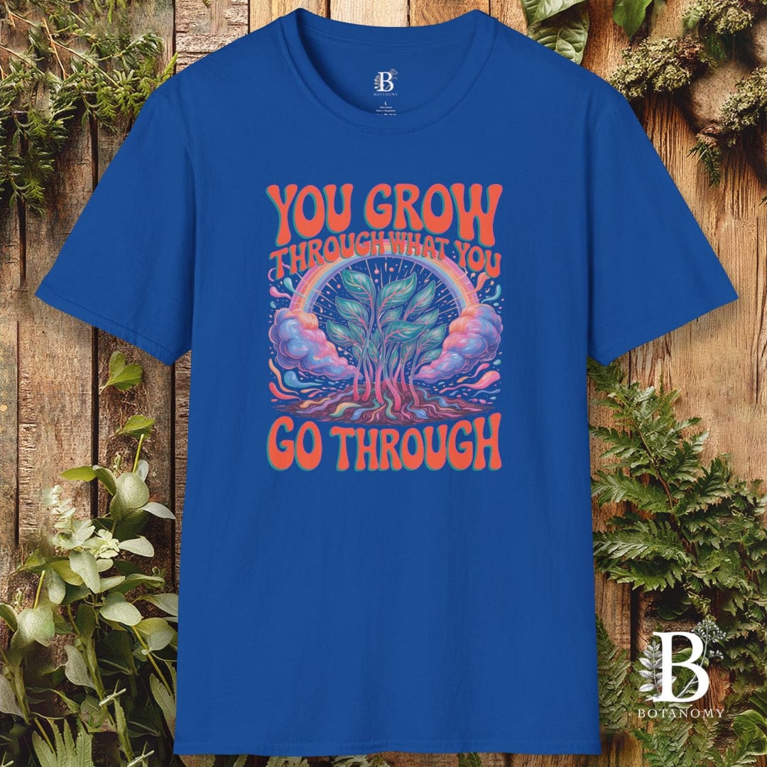 Blue t-shirt with motivational graphic and text on a wooden background