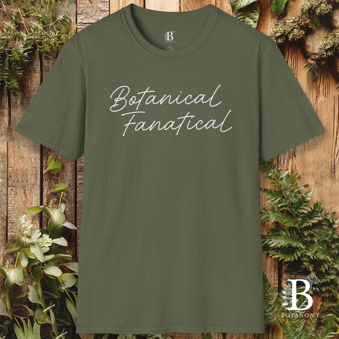 Green t-shirt with 'Botanical Fanatical' text on a wooden background with plants